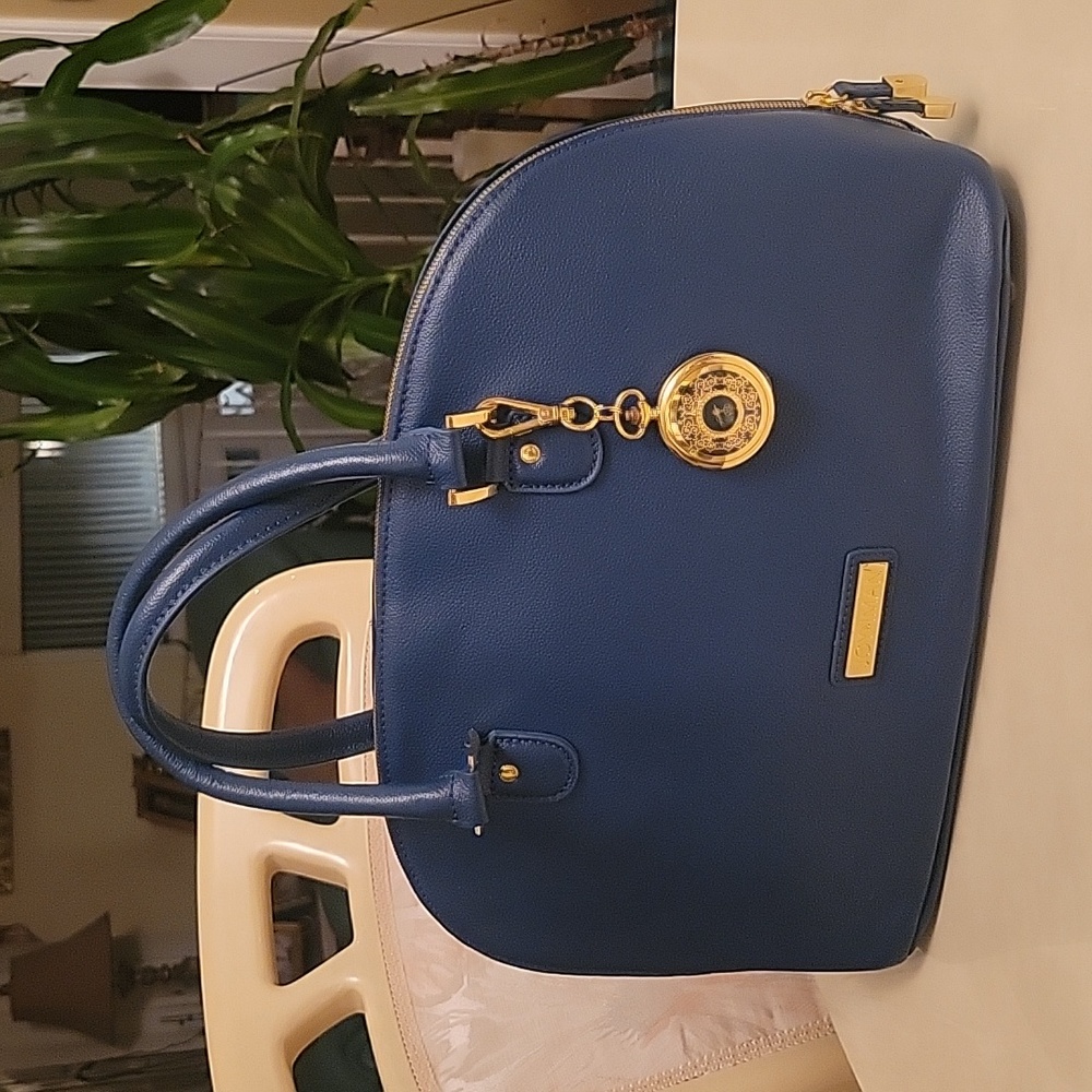 Blue all pebble leather Joy & Iman handbag.